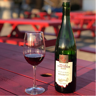 Guests grilling and enjoying the Valley Vineyards cookout experience